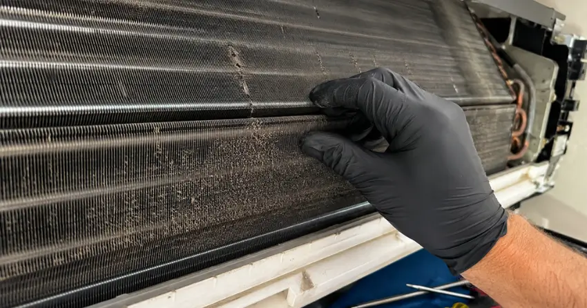 AC repair near me close-up of evaporator coil inspection during service visit