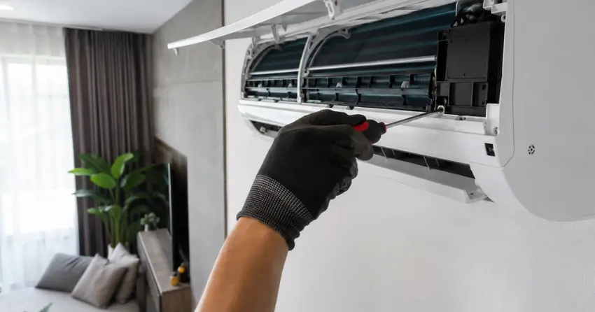 Air Conditioning Maintenance ductless indoor head being serviced